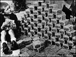 German Child Sitting Next to Pile of Cash Amidst Hyperinflation 
