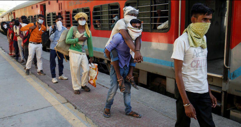 Migrant workers returning from Ahmedabad to their home state of Uttar Pradesh.